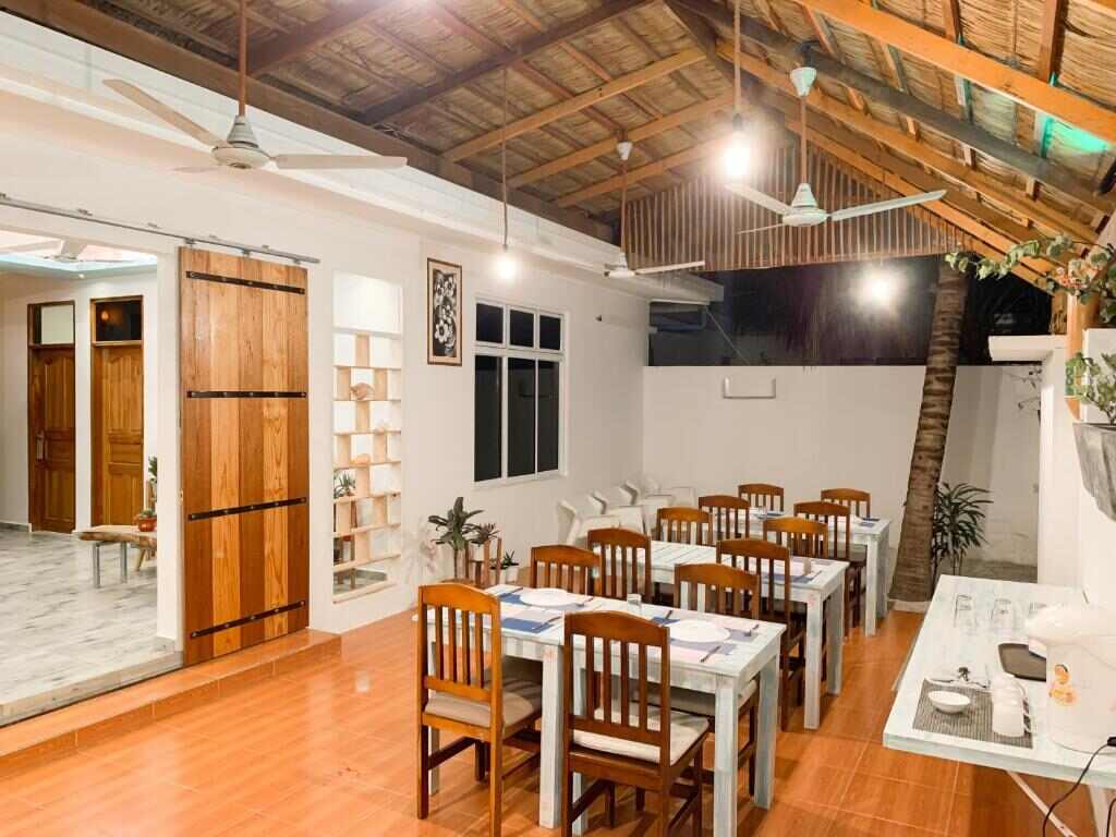 Dining area with wooden roof and set tables